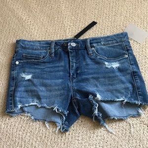 Distressed blue denim shorts